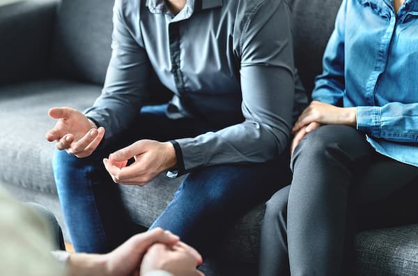 Therapist and client sitting together during counseling session